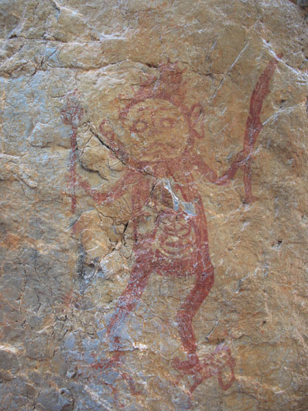 Bức[-]họa[-]sau[-]khi[-]được[-]té[-]nước,[-]hiện[-]lên[-]người[-]đàn[-]ông[-]dữ[-]tợn[-]với[-]tay[-]gươm,[-]tay[-]chùy.